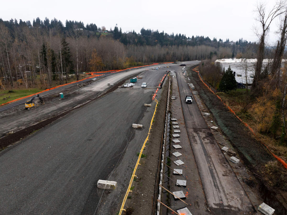 Construction crews work on a toll road that will connect State Route 509 and I-5, on Monday, Dec. 2, 2024, in Tacoma.