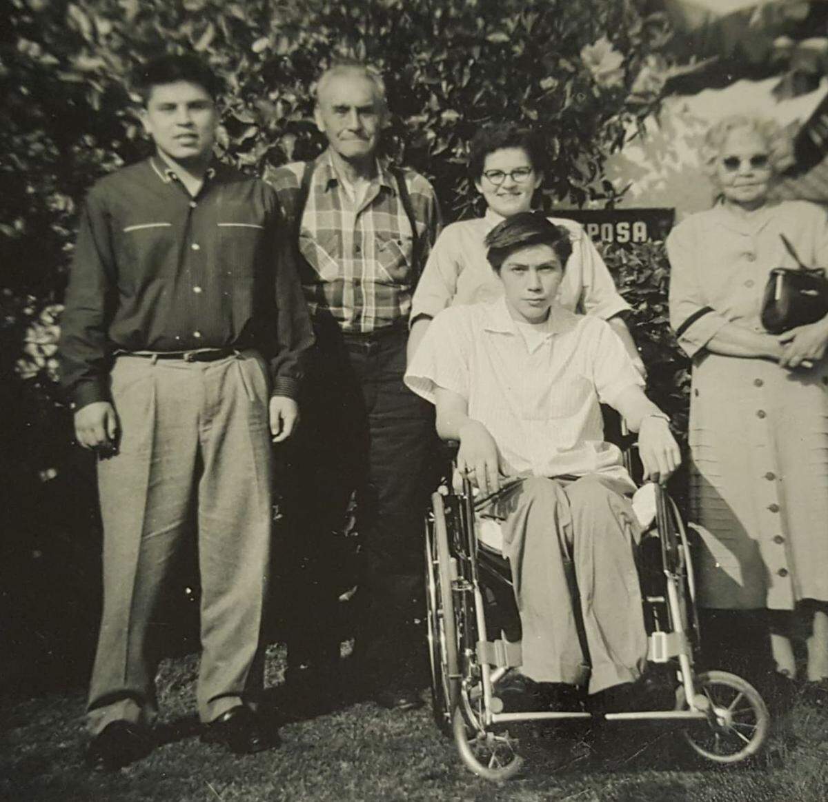 Eugene Landry (in wheelchair) with, from left, cousin Denny Baker, Roland Charley (Myrtle Landry’s father and the last hereditary chief at Shoalwater Bay), unidentified woman and Roland’s wife, Katherine Charley.