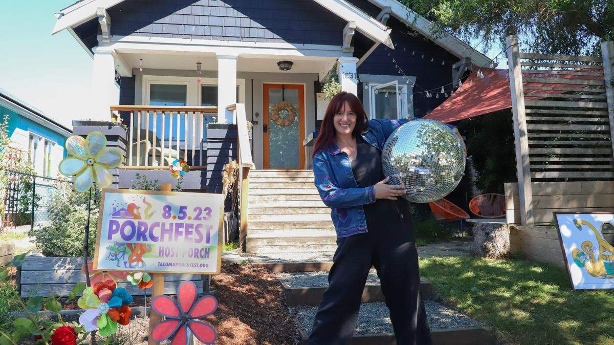 Anna Lee poses in front of her decorated home on Wednesday, Aug. 2. Lee’s boyfriend will perform in her front yard on Saturday, August 5.