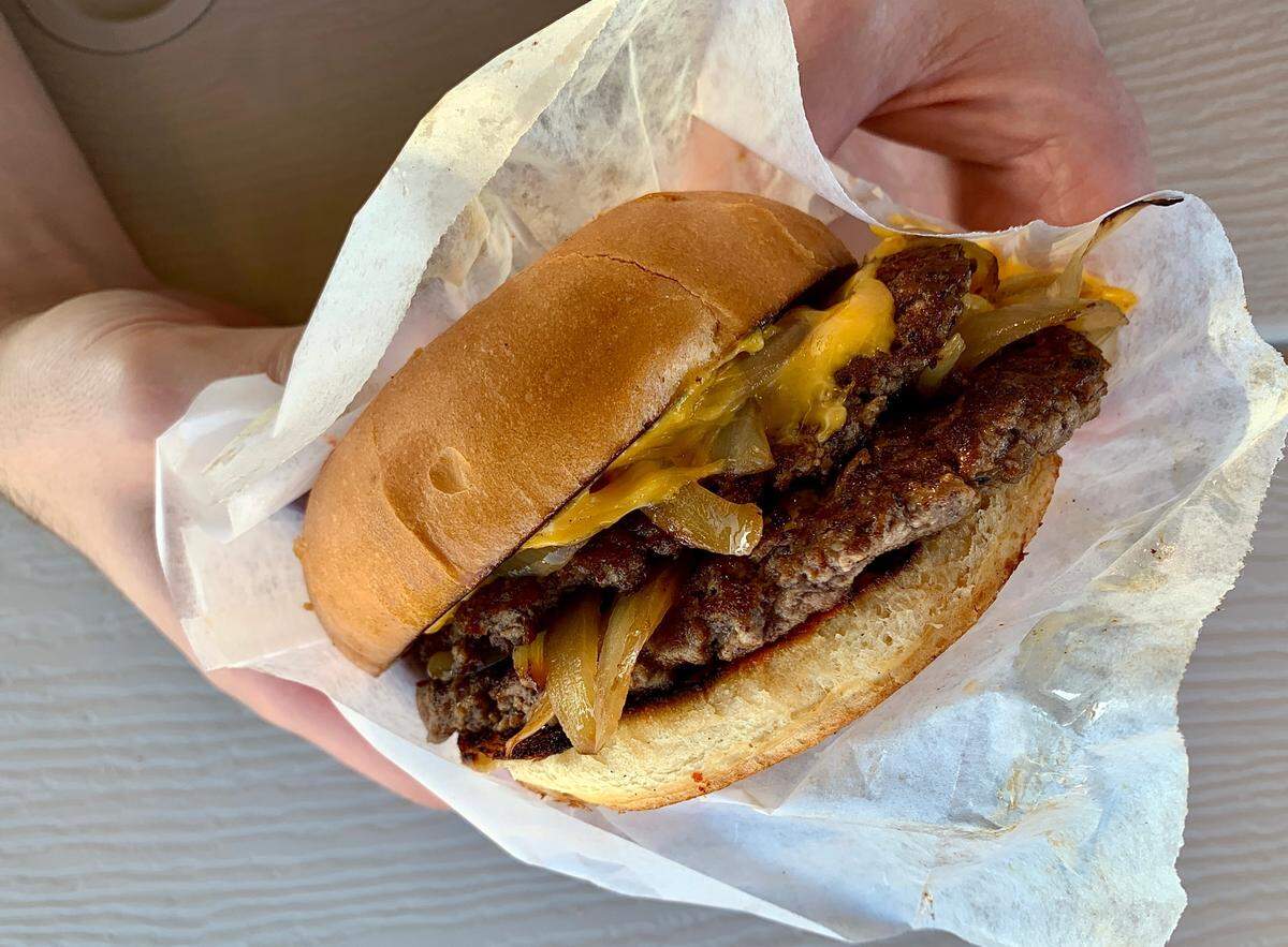 Burger Seoul has been sourcing beef and pork from Dave’s since owner Young La introduced his popular food trailer in Tacoma in 2015. Shown here is a smashburger at La’s new restaurant at 1701 Division Ave.