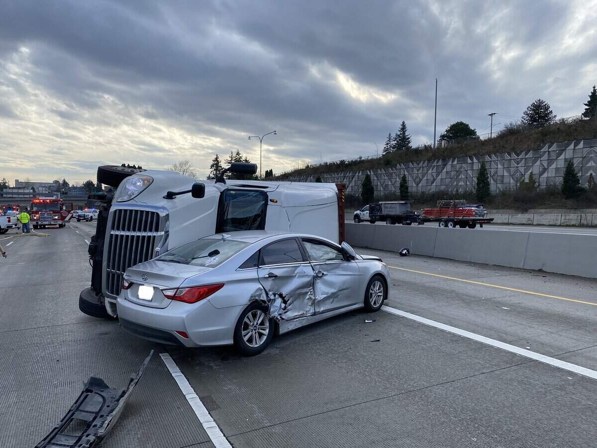 A four-vehicle collision involving three cars and a semi truck Wednesday morning on southbound Interstate 5 near downtown Tacoma caused miles of traffic backups, according to the Washington State Department of Transportation.