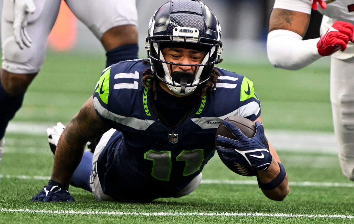 Seattle Seahawks wide receiver Jaxon Smith-Njigba (11) comes down after a reception during the second quarter of the game against the Arizona Cardinals at Lumen Field, on Sunday, Nov. 24, 2024, in Seattle, Wash.