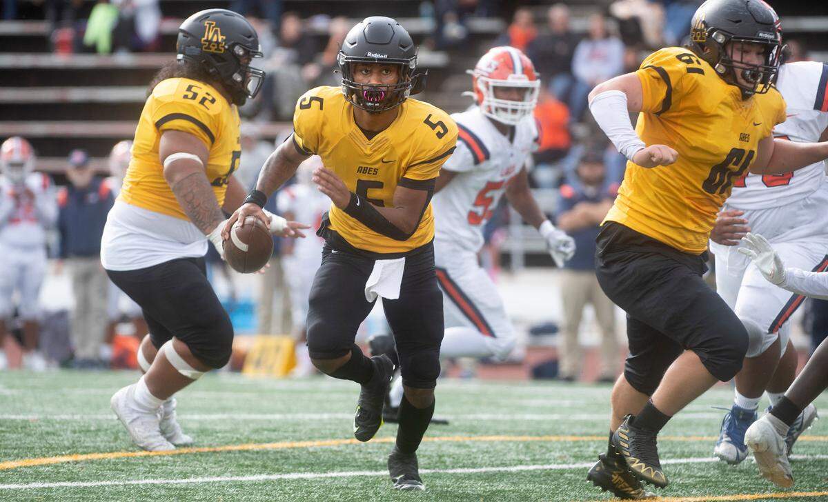 Lincoln quarterback Gabarri Johnson scrambles for a touchdown run during Saturday afternoon’s football game against the Lakes Lancers at Lincoln Bowl in Tacoma, Washington, on Oct. 22, 2022.