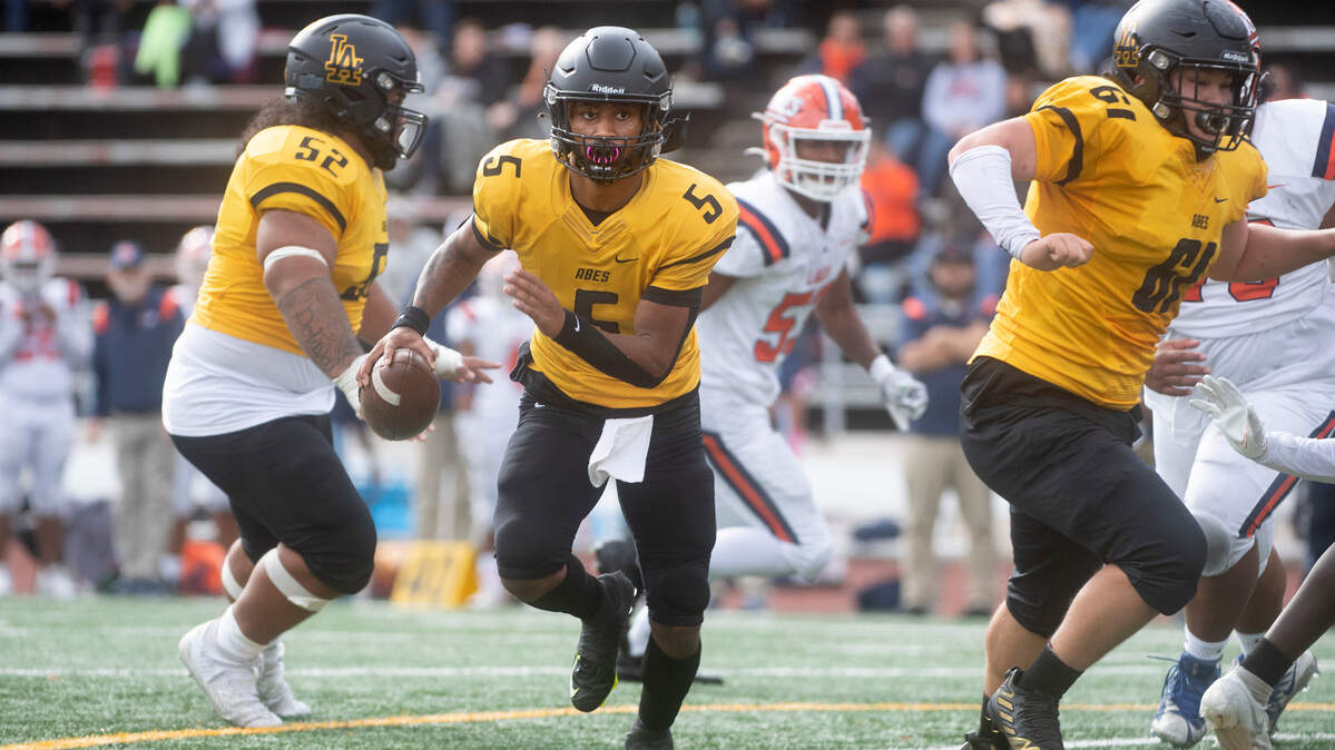Lincoln quarterback Gabarri Johnson scrambles for a touchdown run during Saturday afternoon’s football game against the Lakes Lancers at Lincoln Bowl in Tacoma, Washington, on Oct. 22, 2022.