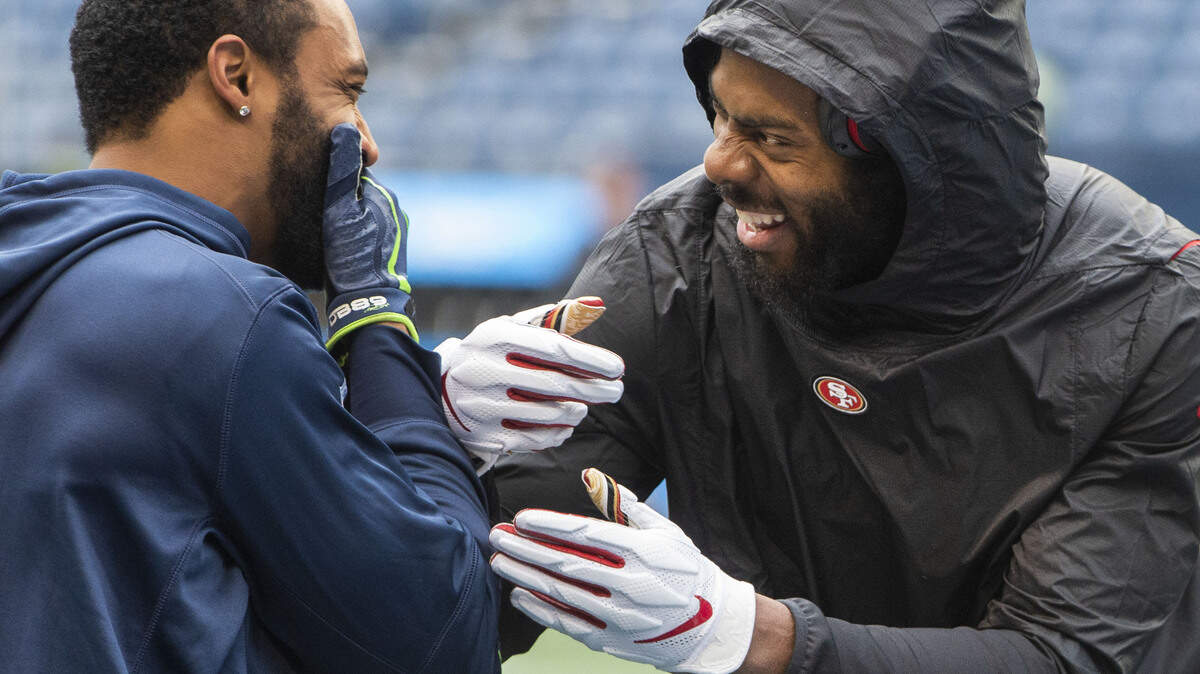 Pro Bowl wide receiver Doug Baldwin (left) and three-time All-Pro cornerback Richard Sherman share a laugh during pregame warmups at CenturyLink Field before the former Seahawks and Stanford teammates played against each other for the first time.The Seattle Seahawks played the San Francisco 49ers  in a NFL football game at CenturyLink Field in Seattle, Wash., on Sunday, Dec. 2, 2018.
