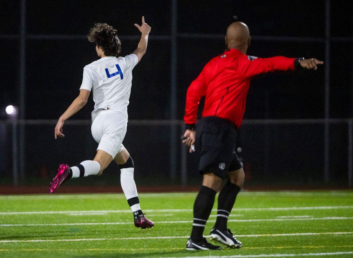 Curtis forward Andrew George (4) runs across the field as he celebrates scoring a goal during the second half of a 4A Pierce County League boys varsity soccer game against Puyallup at Sparks Stadium in Puyallup, Wash. on May 1, 2023. The teams tied the game 2-2.