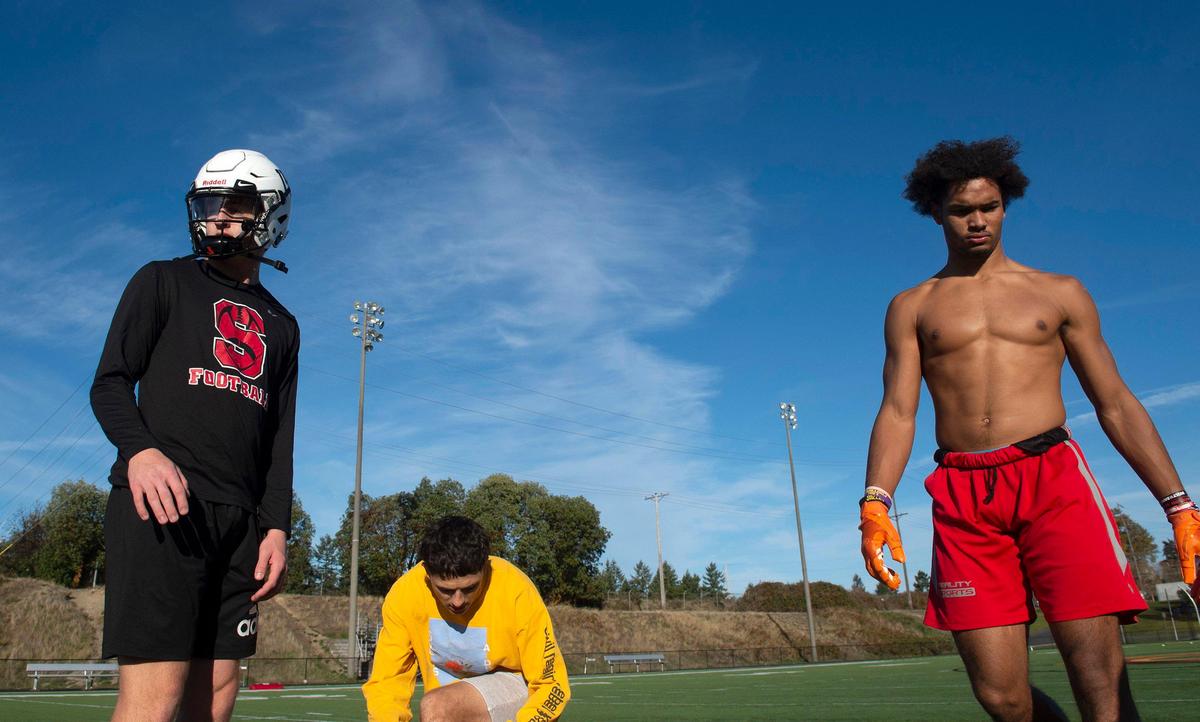 Steilacoom quarterback Chance McDonald (from left), talks with wide receivers Jayden Coalson and Emeka Egbuka during football practice at Steilacoom High School on Wednesday, Oct. 30, 2019.