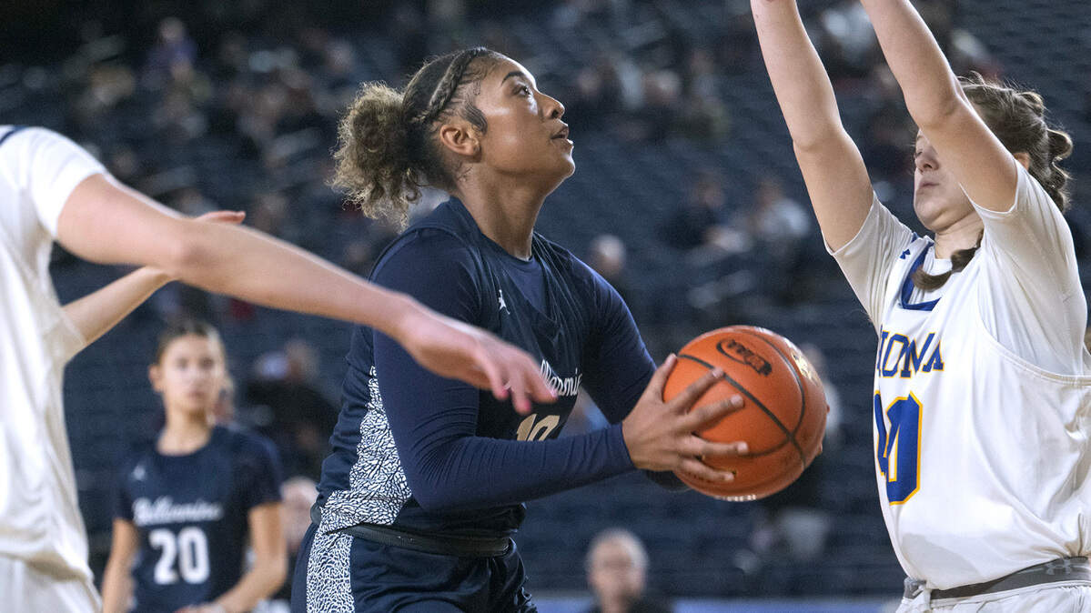Bellarmine’s Kyla Frazier drives the lane against Tahoma defender Adalynn Busch during Wednesday morning’s opening-round game of the 4A girls state basketball tournament in the TacomaDome in Tacoma, Washington, on Wednesday, Feb. 28, 2024. Tahoma won the game, 53-38.