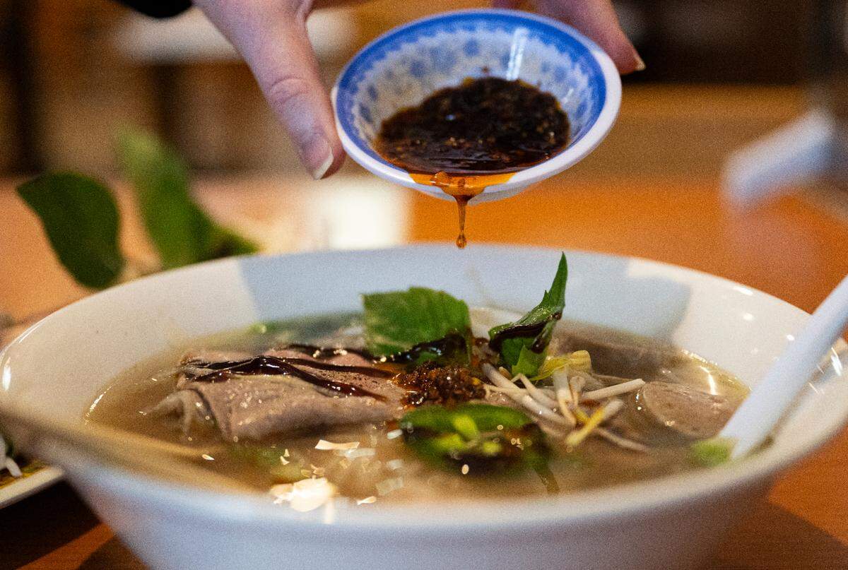 The broth at Pho King is simmered for eight hours with beef bones, onions, Chinese five-spice and other ingredients. Co-owner Andy Nyugen prefers the combo bowl with eye-round steak, flank and fatty flank, tendon, tripe and meatball.