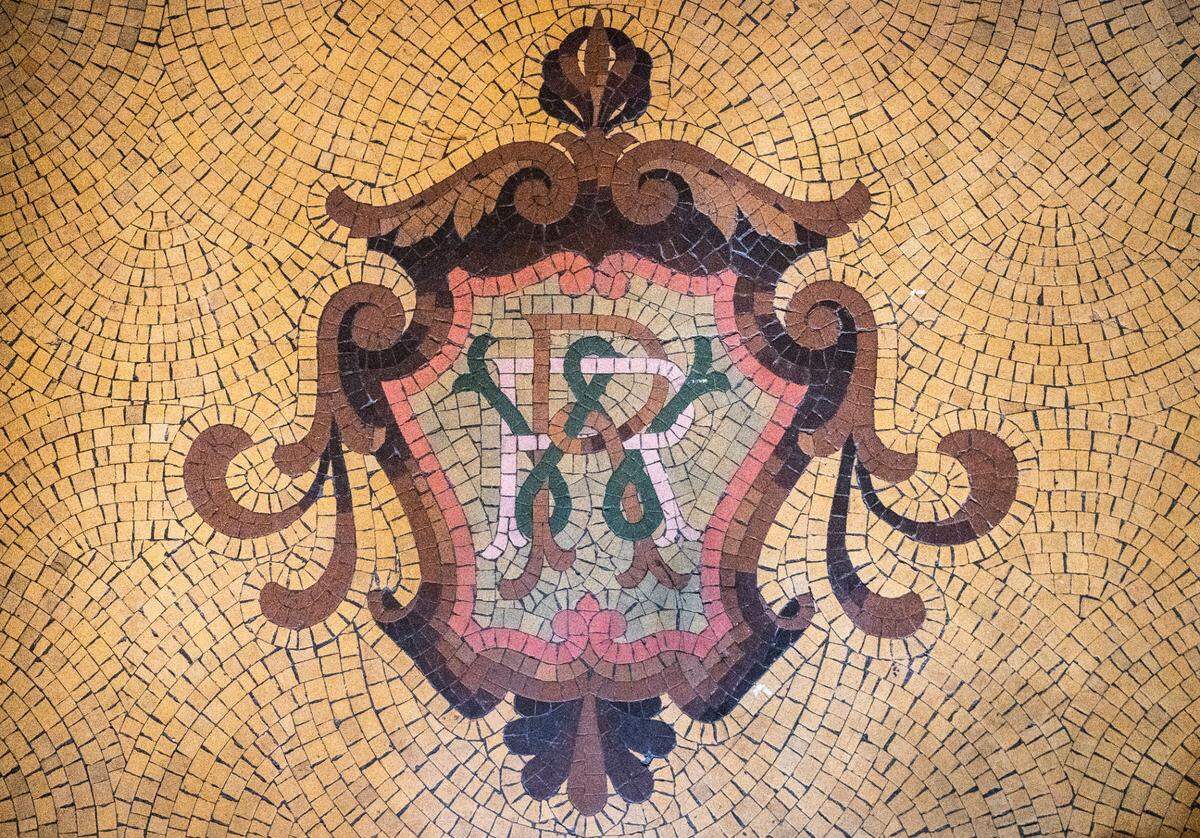 William Rust’s initials are inlaid in the floor of the foyer to the original Rust Mansion.