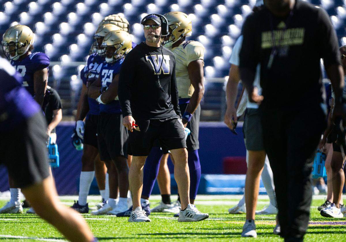 University of Washington Huskies offensive coordinator Ryan Grubb watches players during a drill on the fourth day of Fall practice at Husky Stadium on Thursday, Aug. 7, 2022 in Seattle, Wash.