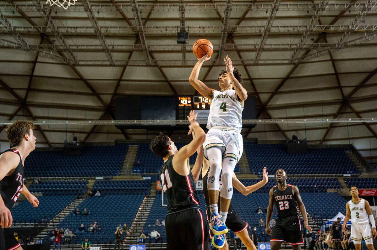 Timberline guard Brooklyn Hicks (4) attempts a shot as Mountlake Terrace guard Vito Mkrtychyan (21) defends in the fourth quarter of a Class 3A state tournament game on Wednesday, March 2, 2022, at the Tacoma Dome, in Tacoma, Wash.
