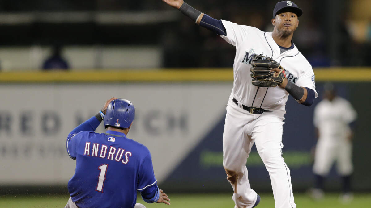 Texas Rangers’ Elvis Andrus is forced out at second as Seattle Mariners shortstop Jean Segura makes the throw to first to complete a double play on Nomar Mazara during the sixth inning of a baseball game, Saturday, Sept. 29, 2018, in Seattle. (AP Photo/John Froschauer)