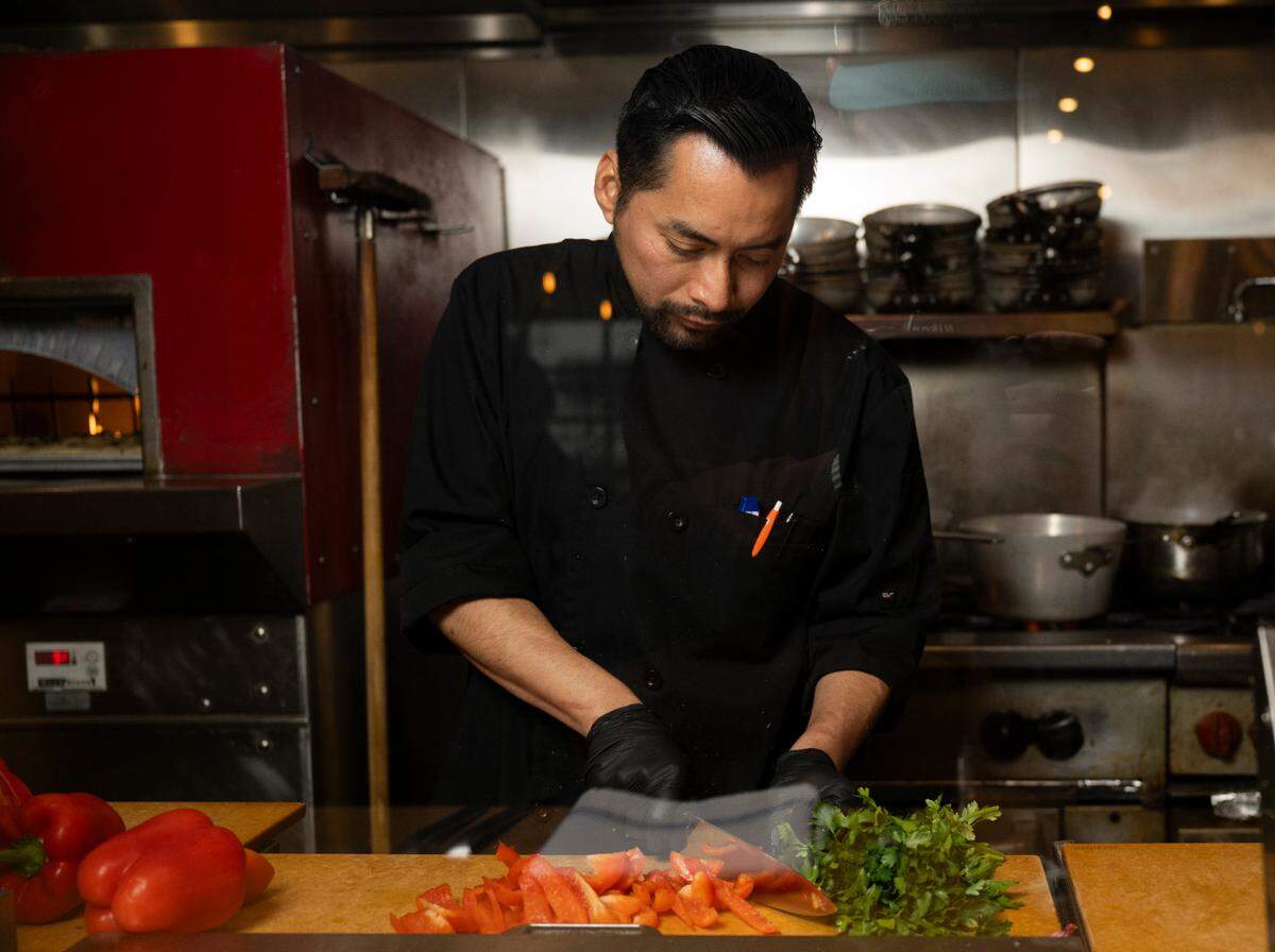 Head chef Ben Perez preps for dinner service on Friday, Jan. 31. He worked alongside Chef Charlie McManus for many years and will lead the Primo team under the Roses’ ownership.