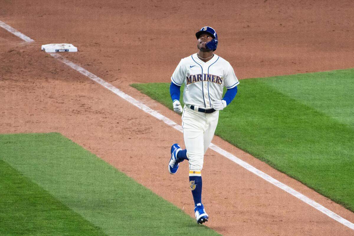 Seattle Mariners Kyle Lewis reacts as he hits a home run in the eighth inning. The Seattle Mariners played the Oakland Athletics in a Major League Baseball game at T-Mobile Park in Seattle , Wash., on Sunday, Aug. 2, 2020.