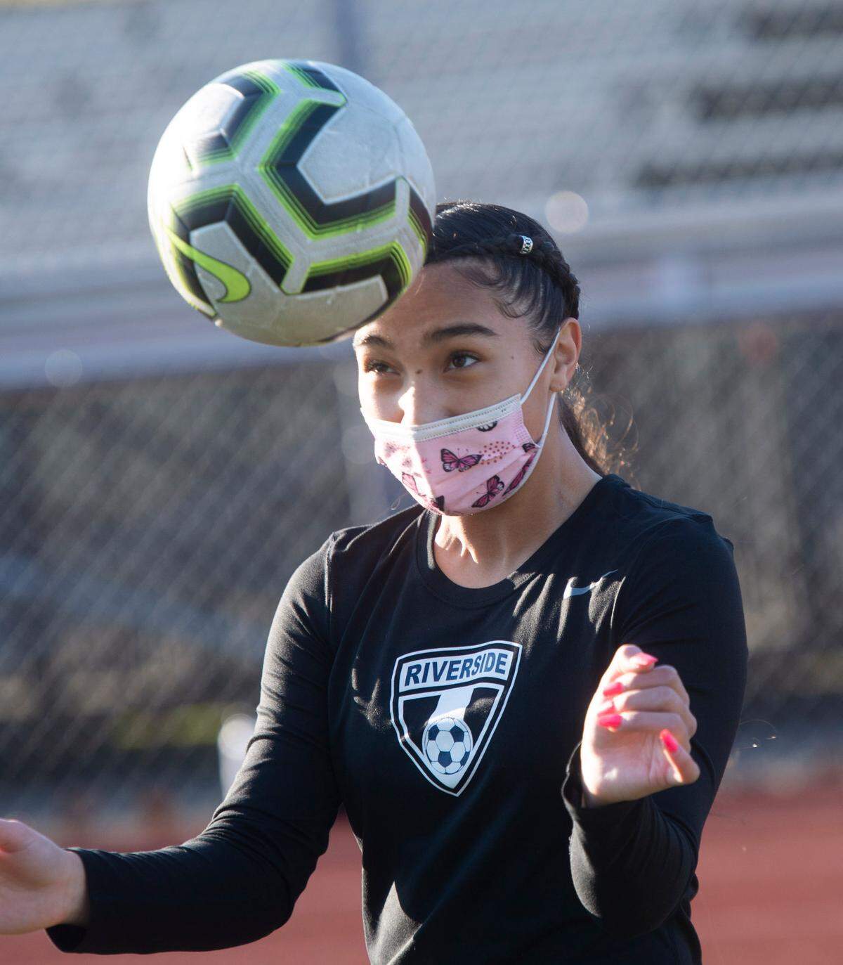 Auburn Riverside forward Samiah Shell practices headers during a recent practice in Auburn on Wednesday, March 10, 2021.