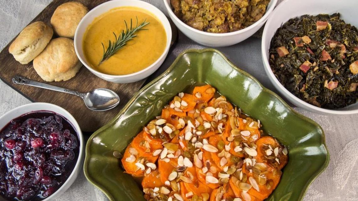 Turn our reader submitted recipes into your own family favorites. Pictured here are orange-glazed sweet potatoes, bottom, and, from left to right, cranberry sauce with port and figs, pumpkin bisque and cream biscuits, slow-cooker stuffing with chicken sausage and cornbread and sweet and spicy greens.