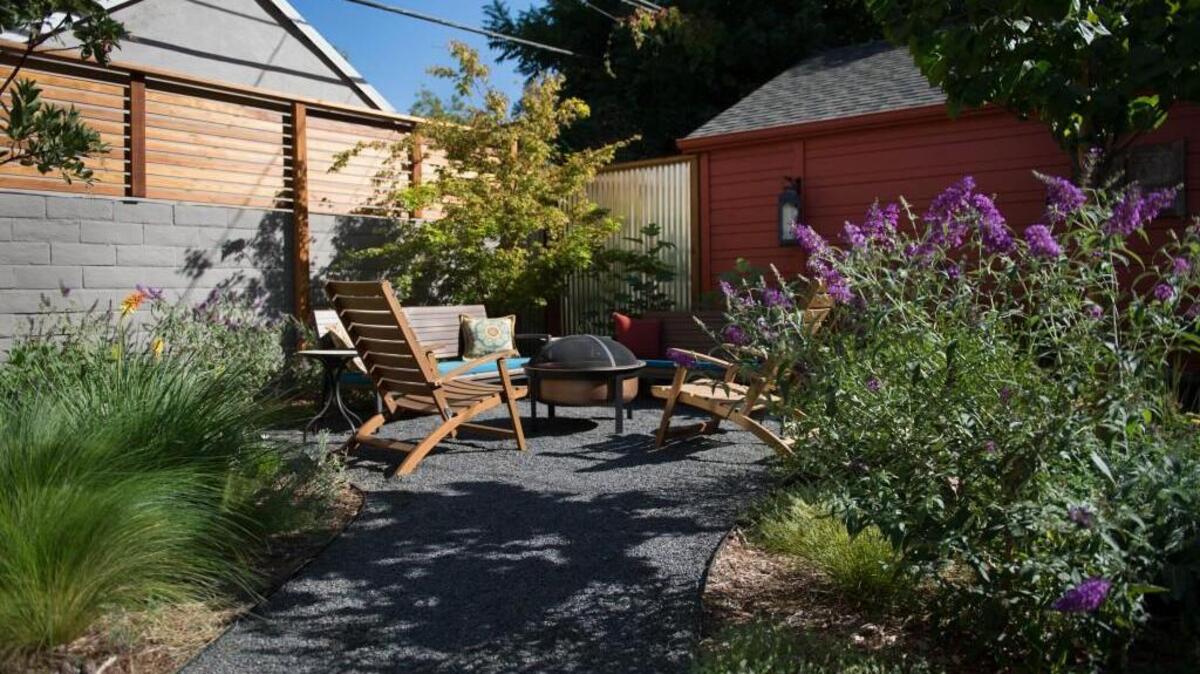 This backyard has a remodeled patio and pocket garden that is filled with hops, tomatoes and herbs.