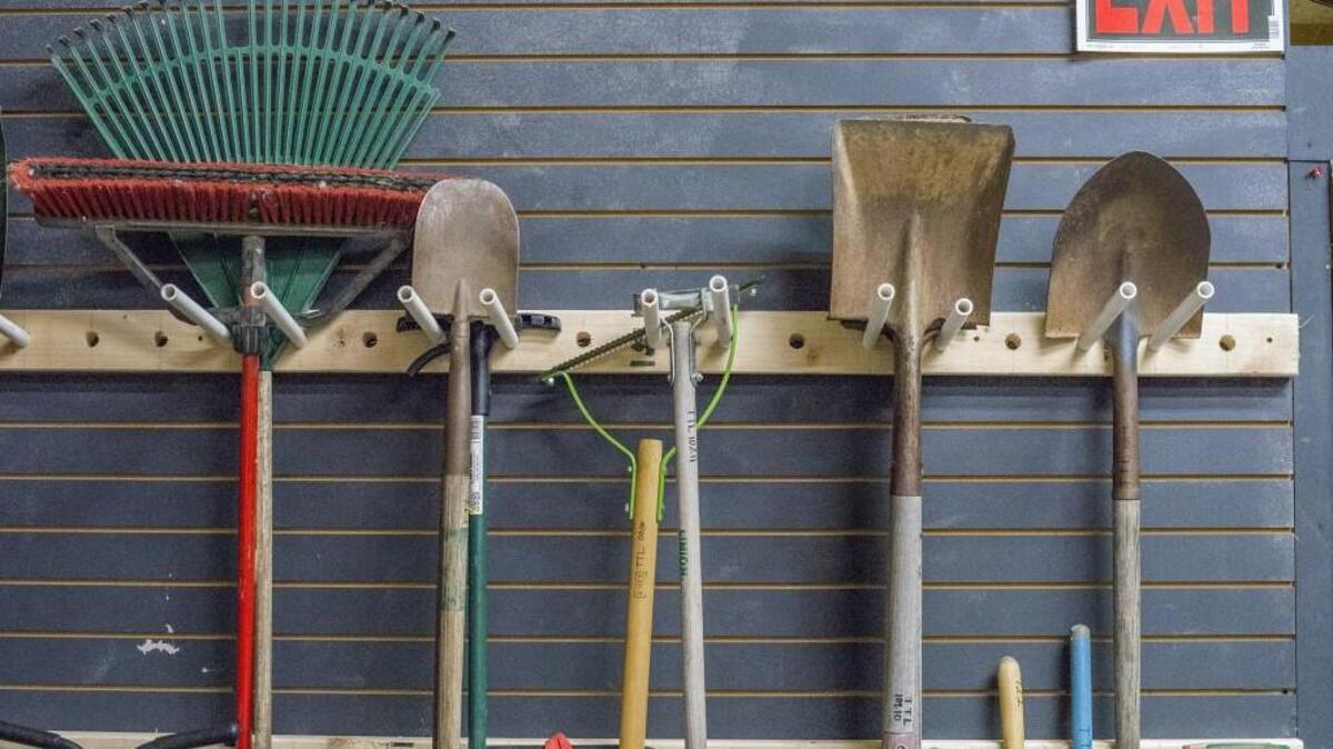 The tools were all hung, in the carport with care, with hopes that St. Nicholas soon would repair.