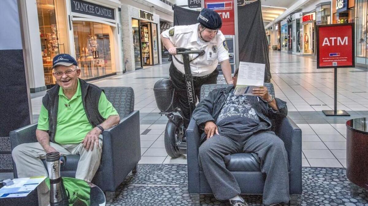 
Security officer Jamie Green playfully surveills mall walkers Robert Webster, right, and Joe Frame on Tuesday, Sept. 29, 2015 at the Tacoma Mall. The mall, for many, is a modern day community center that opens it’s doors to the community for exercise and companionship.
