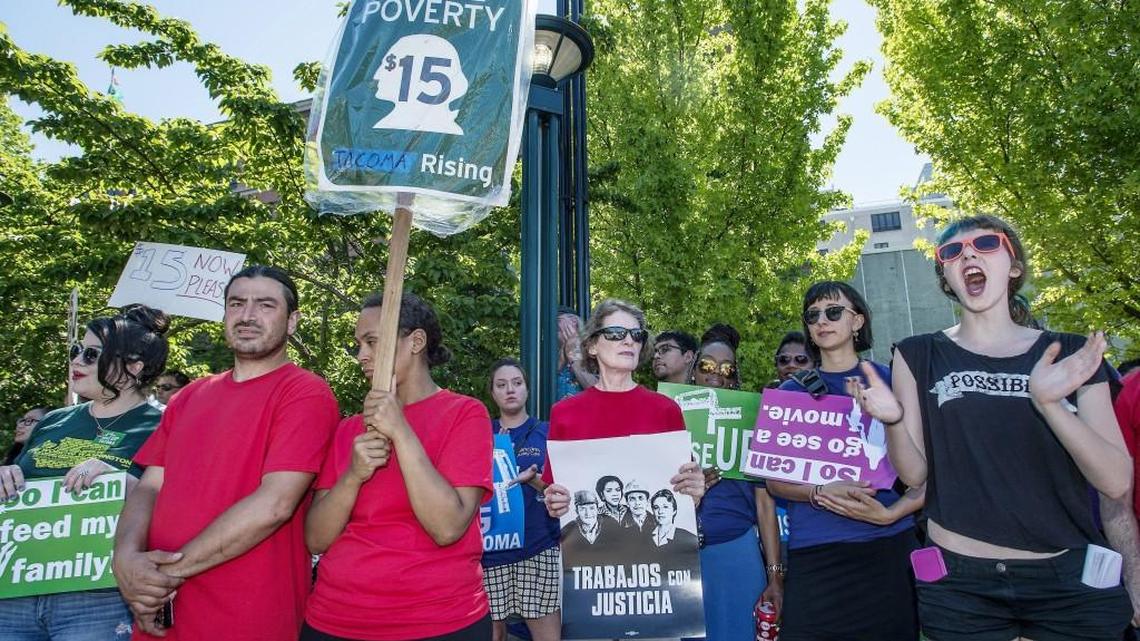 Members of 15 Now Tacoma joined Raise Up Tacoma, Labor activists and union members Tuesday 06/30/15 for a minimum wage rally at the Theater On The Square in Tacoma.