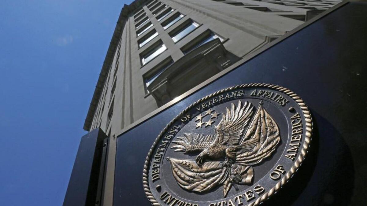 The seal affixed to the front of the Department of Veterans Affairs building in Washington. The agency has issued a revised rule allowing payment of hundreds of thousands of pending claims for private sector emergency care that veterans’ other health insurance covered in part but not in full.