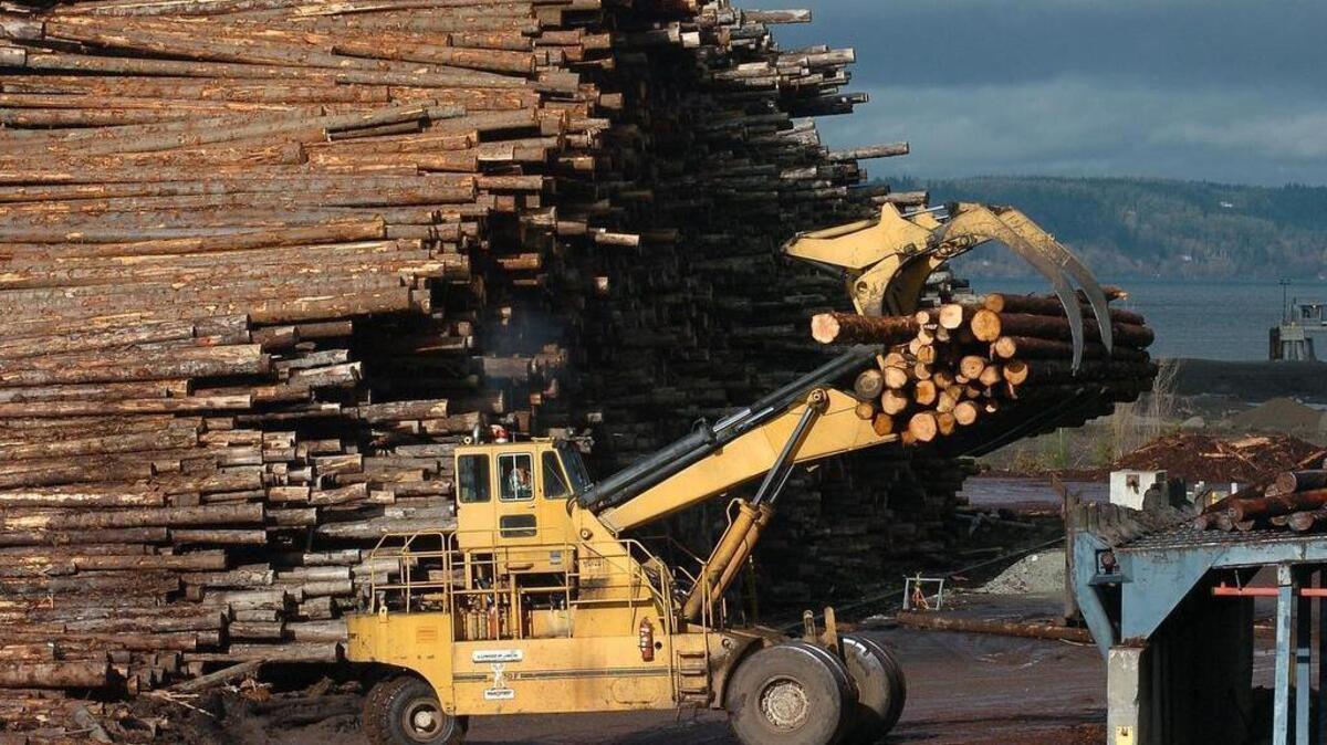 
Logs were piled high for sawing into lumber at the sawmill in Tacoma in January 2006. Canadian forest products company Interfor Corp. is putting the mill back on the market a mere five months after it completed its purchase.

