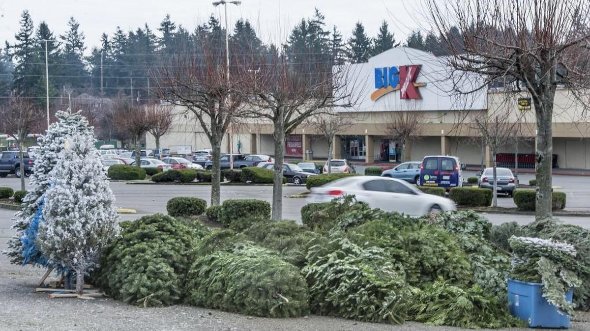 Unsold trees lie in a parking lot near Kmart on Sixth Avenue in Tacoma in 2014. The Tacoma Kmart store on Sixth Avenue is one of many locations closing across the nation.