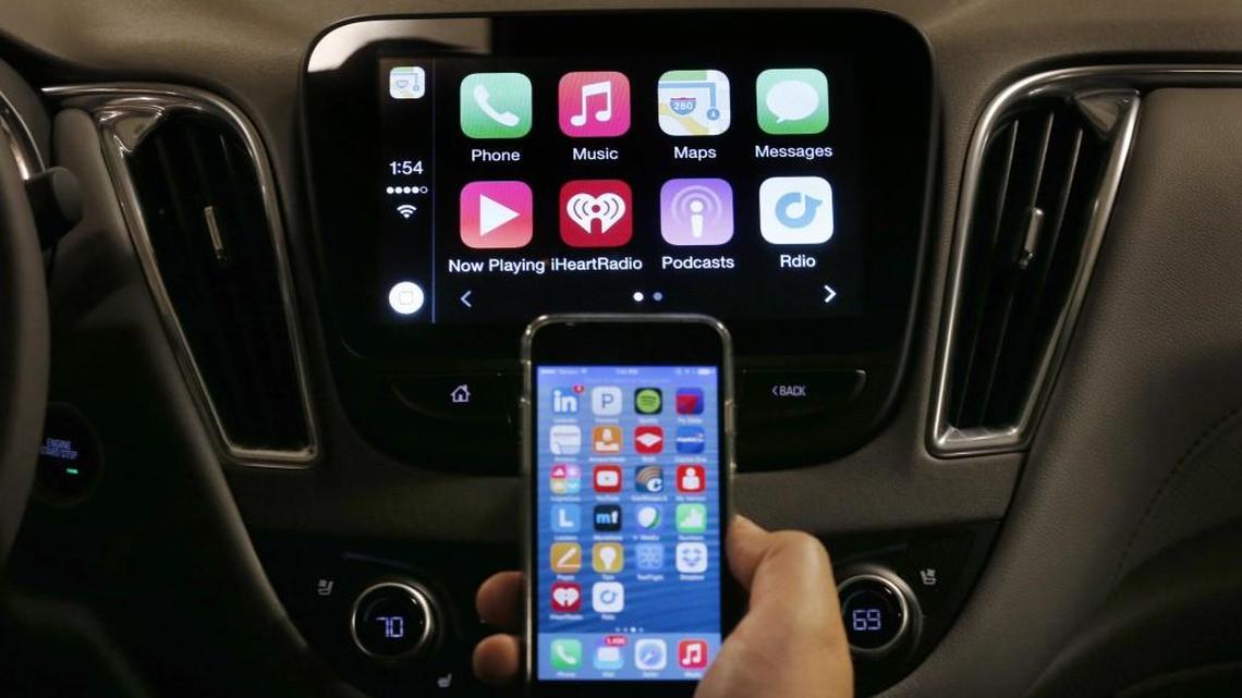 An iPhone is connected to a 2016 Chevrolet Malibu equipped with Apple CarPlay apps, displayed on the car's MyLink screen. For those who still use their smartphones for calls, a new area code is coming to this state.