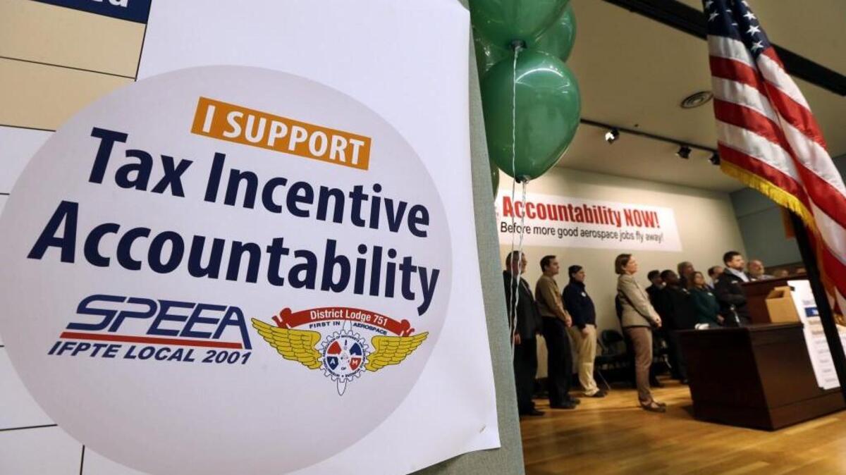 Speakers address a news conference about accountability for a tax break extension to Washington's aerospace industry, Monday, Nov. 9, 2015, in Seattle.