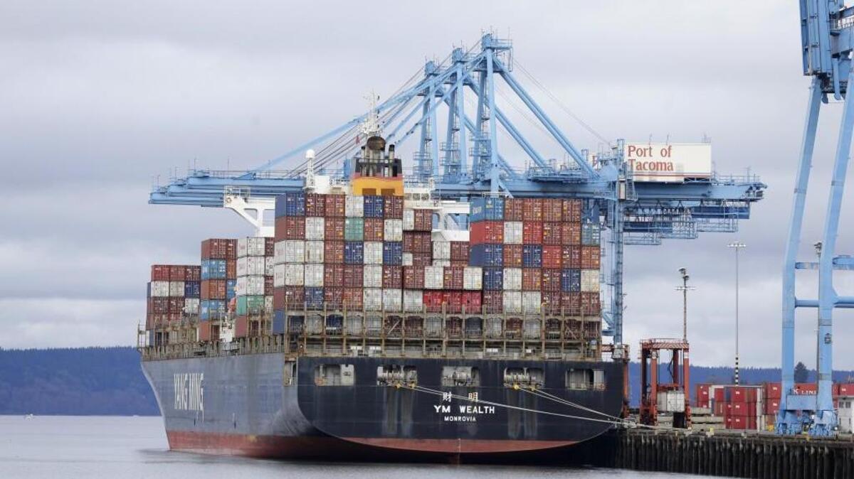 A cargo container ship operated by Yang Ming Marine Transport Corp. sits docked at the Port of Tacoma, Friday, Feb. 20, 2015, in Tacoma.