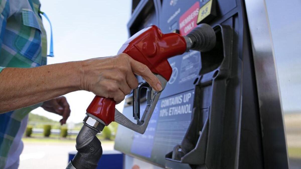 
A woman fills her car at a Costco gas station in Pennsylvania. 
