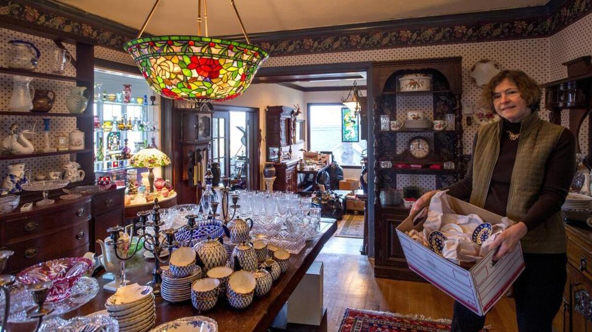 Appraisal and estate sale specialist Mary Sudar pauses while preparing a sale in a North Tacoma home in November.