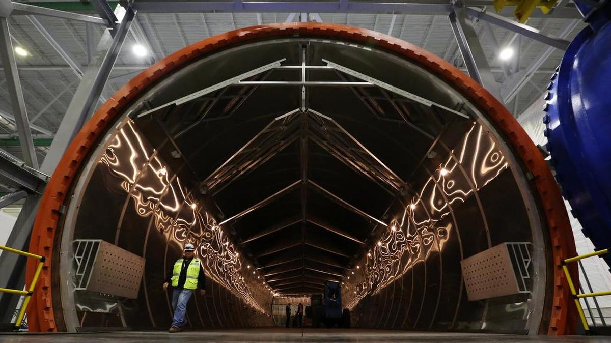 A worker emerges from the autoclave, where parts will be “baked” at Boeing’s massive new 777X composite wing center, scheduled for its grand opening on Friday.