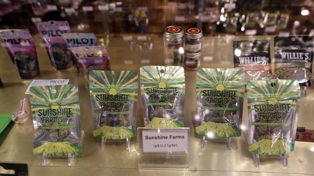 Marijuana products fill a display cabinet in the Herban Legends pot shop Thursday in Seattle. Attorney General Jeff Sessions has rescinded an Obama-era policy that paved the way for legalized marijuana to flourish in states across the country, creating new confusion about enforcement and use just three days after a new legalization law went into effect in California and the same day the Vermont House passed a bill for legalization.