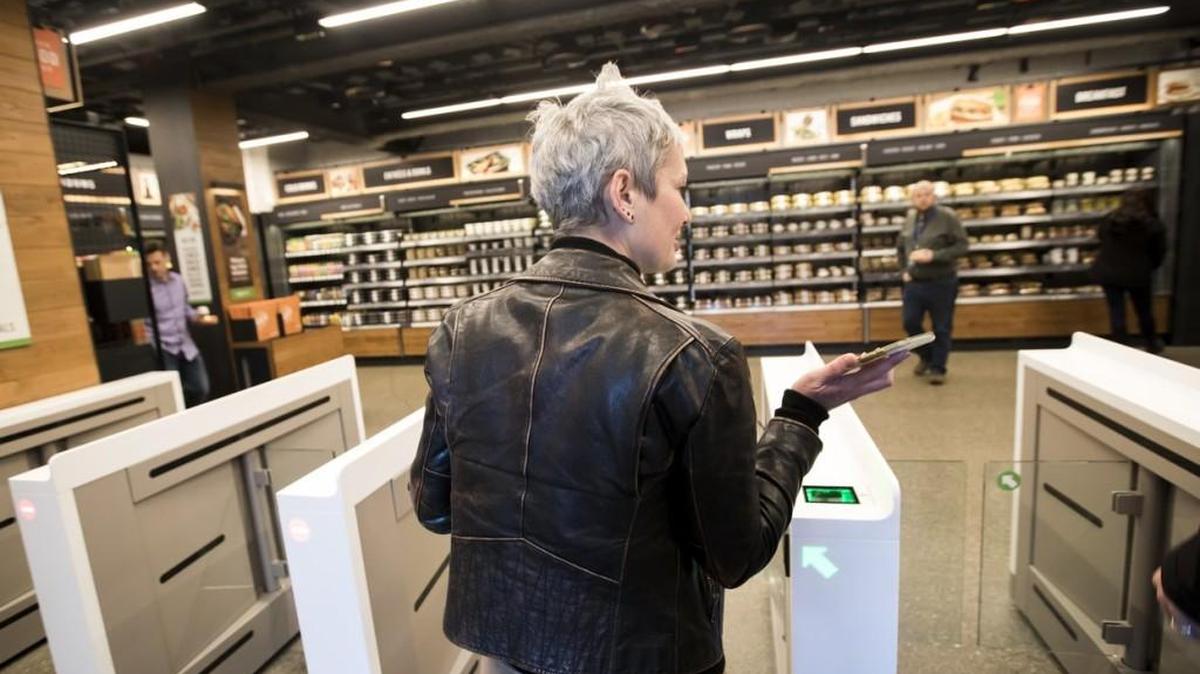 Gianna Puerini, vice president of Amazon Go, heads toward the entrance of the cashierless store recently, using her phone to scan in.