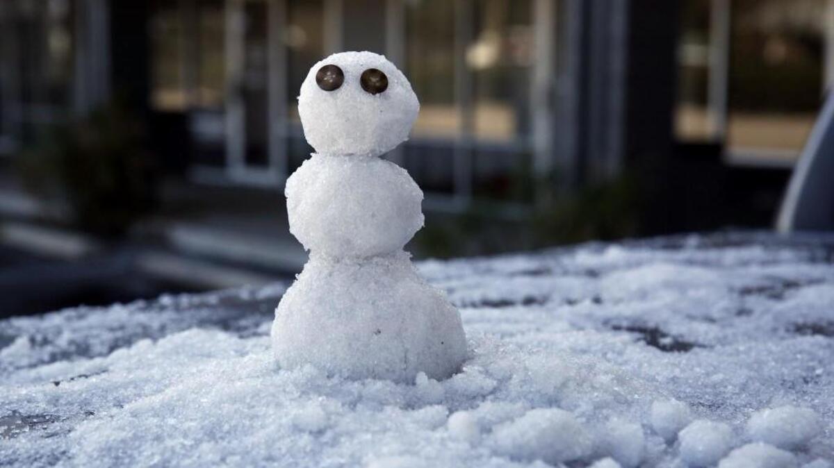 A snowman sits on the back of a truck Wednesday in Tallahassee, Fla. Schools closed in parts of Florida as the state braces for an unusual winter storm that could bring a mix of snow and ice across several counties along the state’s northern border. Travelers in the rest of the nation are bracing for canceled flights.
