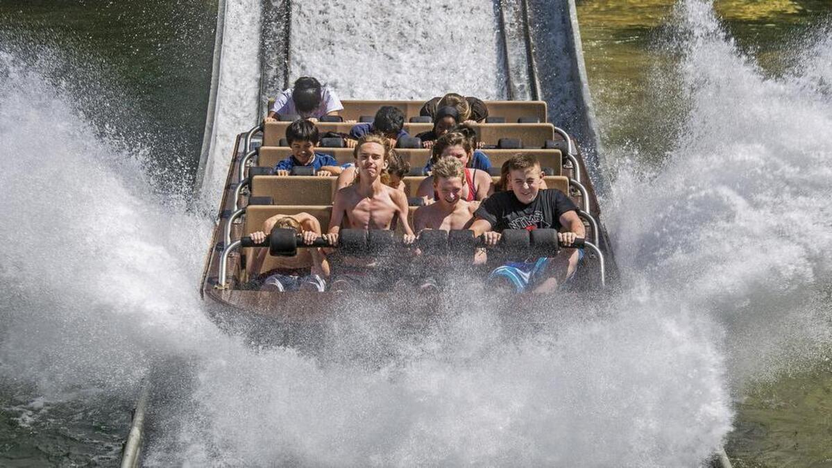 North Tapps Middle School graduates, from left, Tyler Allbritton, Jagur Swepston, Liam Casey-Minnick and Corbin Bender ride Lumberjack Falls during a class outing to Wild Waves in Federal Way. The theme park is interviewing for positions this week.
