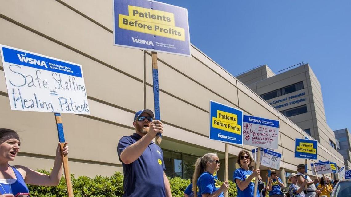 Nurses picket in front of MultiCare’s Tacoma General Hospital in June.