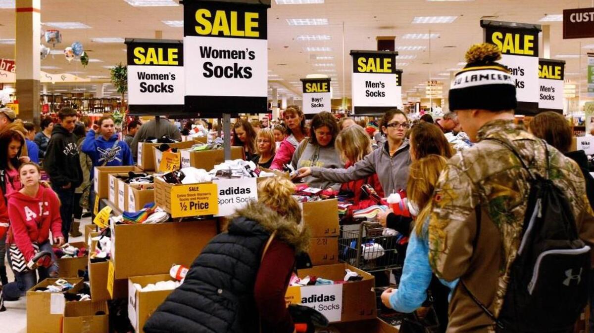 Shoppers seek out sale-priced socks on Black Friday at Fred Meyer in Roseburg, Ore., on Nov. 28, 2014.