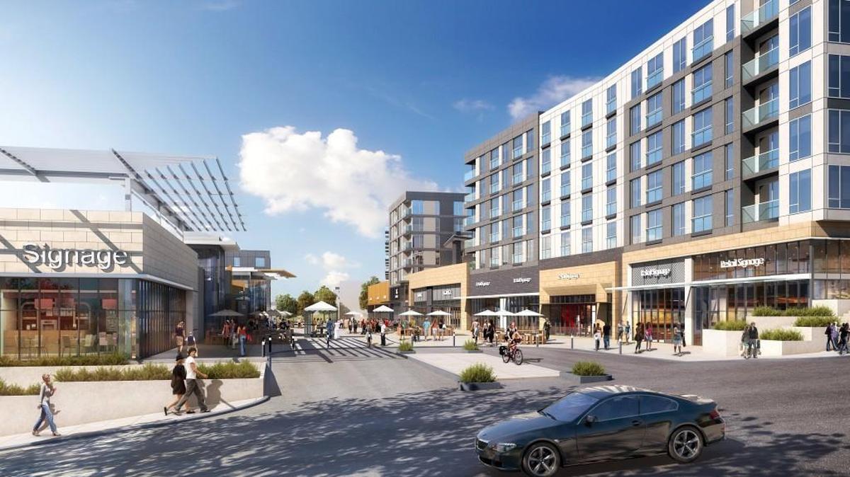 The Tacoma Town Center development includes a pedestrian plaza along Fawcett Avenue, flanked by residential and retail buildings. In plans submitted to the city of Tacoma, the two buildings in the back would be constructed first.