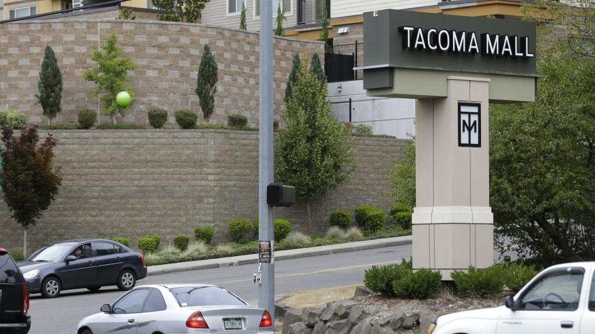 Cars pass by an entrance to the Tacoma Mall. Forever 21 may be making its return to the mall.