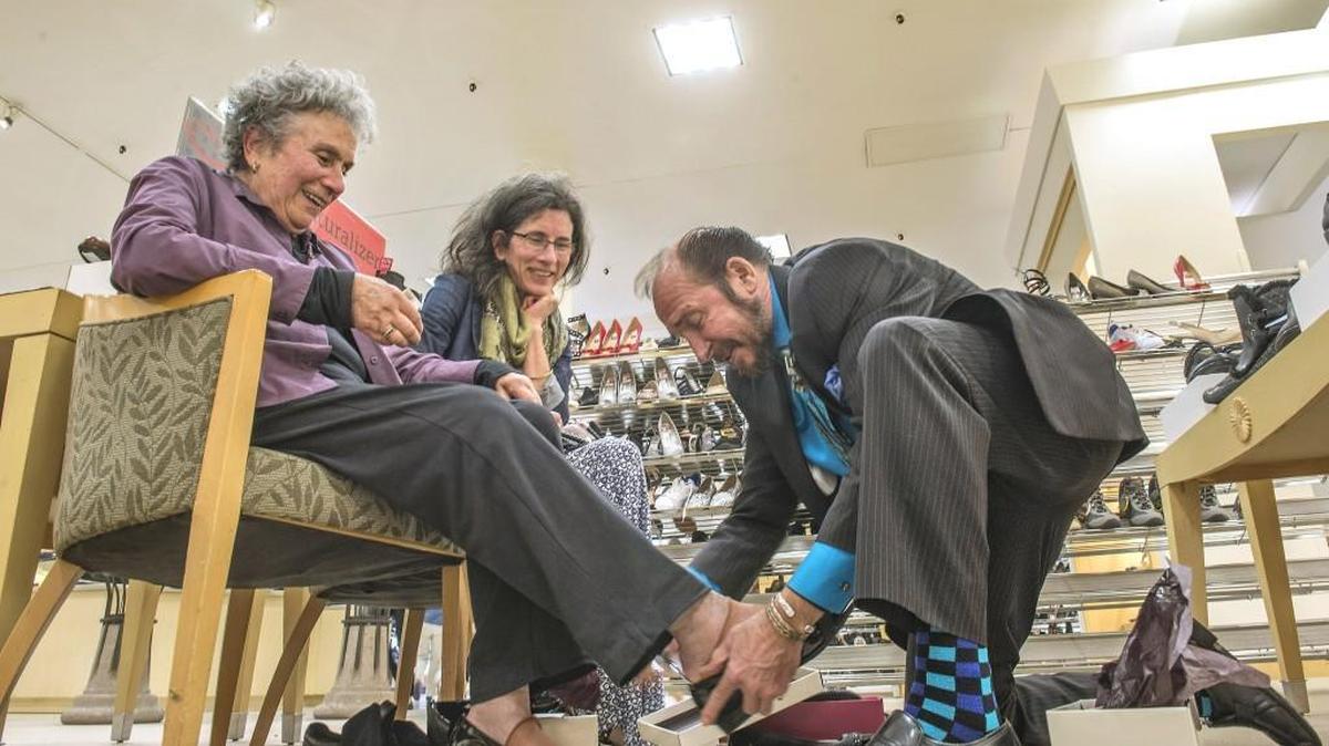 Skip Butler, seen here helping customers in 2015 at the Tacoma Mall Macy’s, retired Nov. 1 after 52 years working at the store.