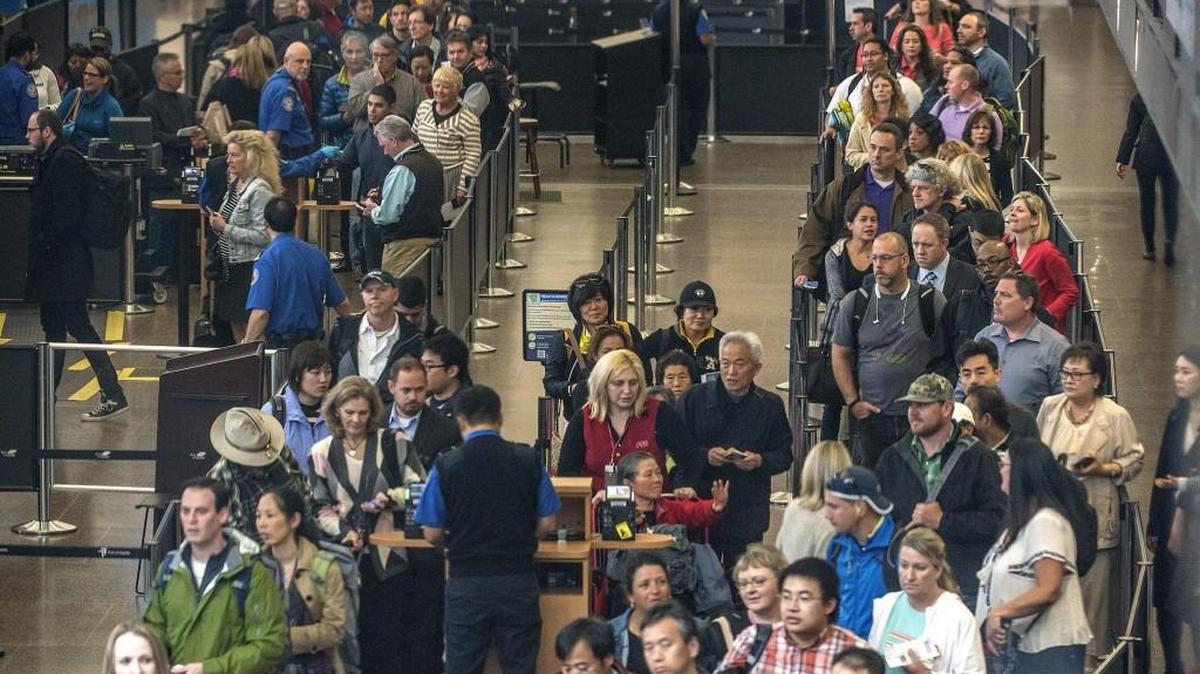 Passengers wait at a security checkpoint at Sea-Tac Airport on April 24, 2015.