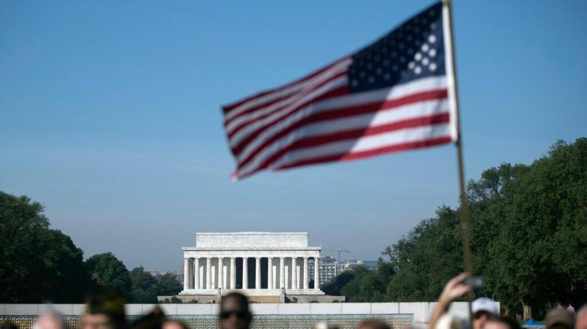 The Military Coalition rallies at the National World War II Memorial in 2013 to demand an end to that year’s partial government shutdown. Now, the group is asking its coalition of 32 leading veterans and uniformed services organizations to line up against a Senate bill that would push the costs of some military benefits onto service members and veterans.