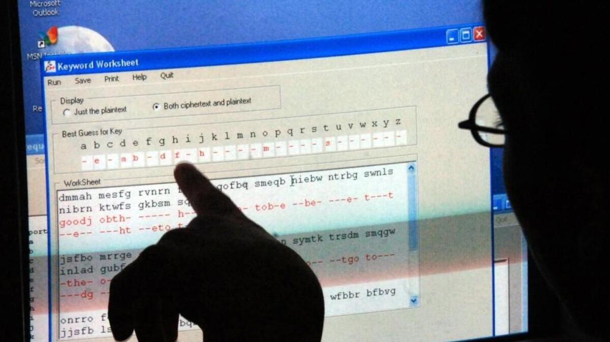 Working with a code breaking software, a boy looks for the key letters that will break a coded message during a summer-long camp in 2006. The UWT’s annual South Sound Technology Conference will be talking about kids and coding, among other things.