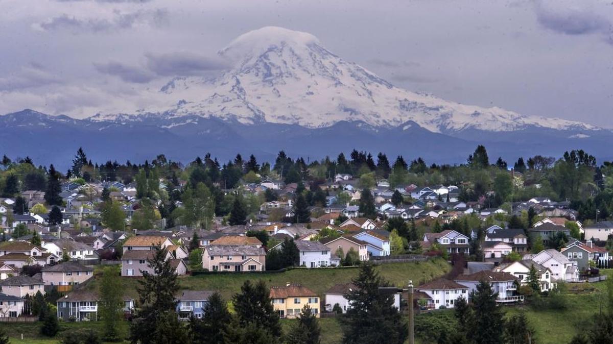Mount Rainier looms behind Northeast Tacoma, where the median home price skyrocketed $122,500 in a year, to $417,500.