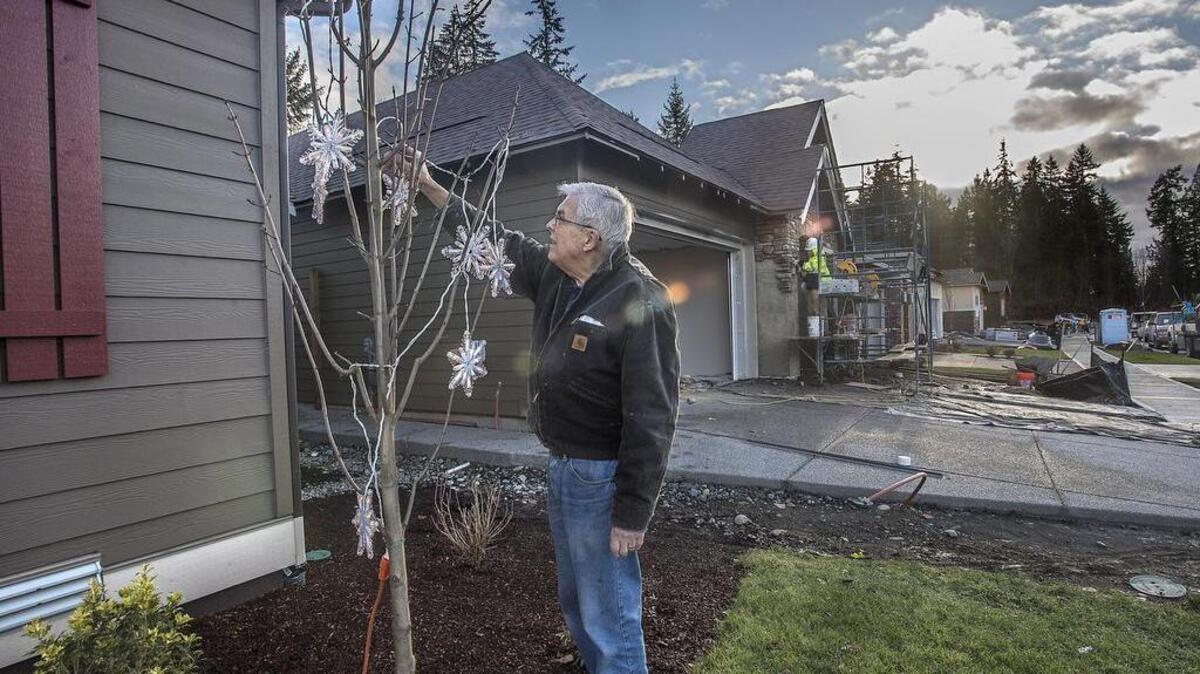 Decorating his new home with a holiday touch, Paul Soderlund, and wife Judy moved from Bainbridge Island to the 55-plus community Trilogy at Tehaleh in Bonney Lake two months ago.