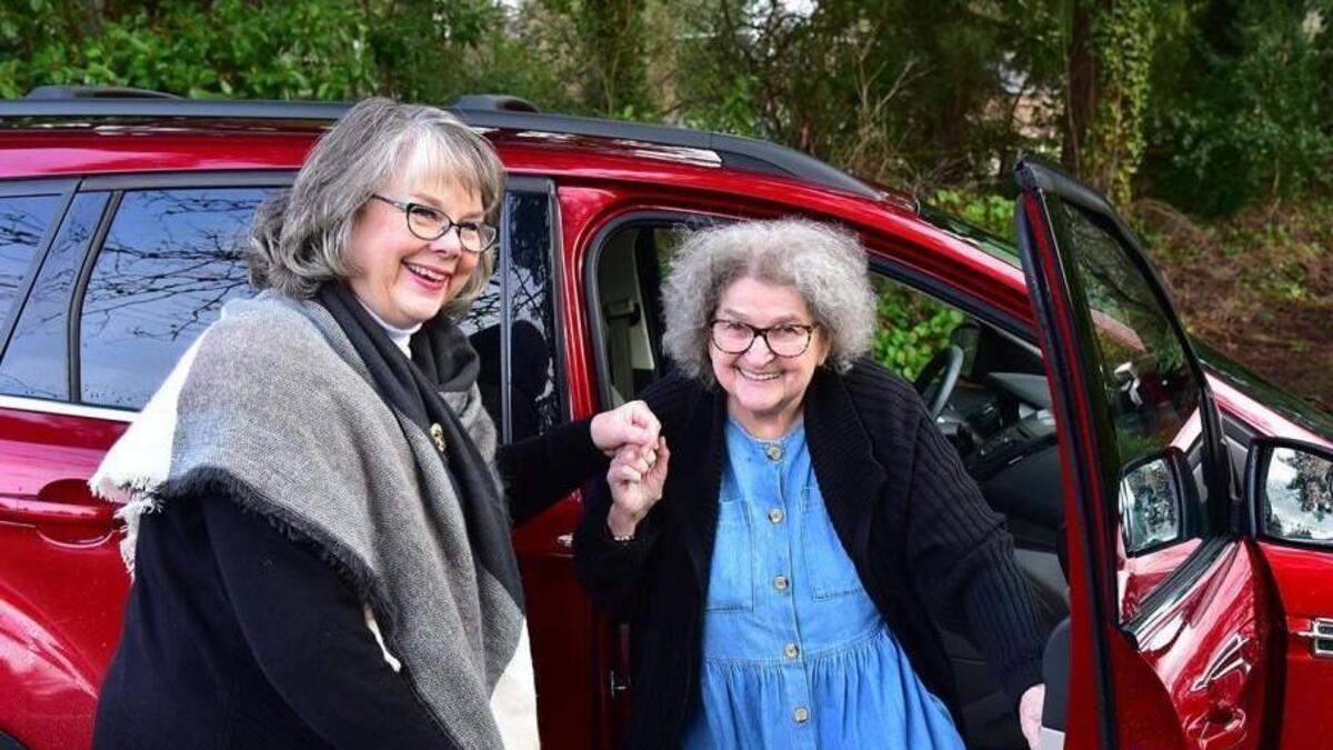 Local Envoy driver Wendy Allred (left) with a passenger. Envoy America is currently hiring more drivers in the area, servicing Thurston, Pierce, King and Kitsap counties.