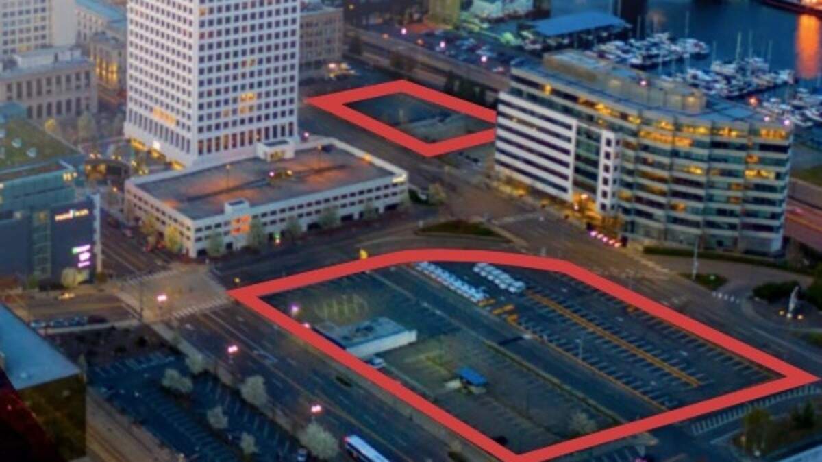 This illustration shows Tacoma’s “Super Block” and another parcel, which are being marketed for sale at $17.37 million. The sites now serve as paid parking for surrounding buildings and businesses.